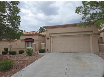 Charming single-story home featuring desert landscaping and a spacious two-car garage at 9329 Fresh Spring Dr, Las Vegas, NV 89134