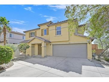 Two-story tan home featuring a tile roof, two car garage, and xeriscaping at 1109 Claire Rose Ave, Las Vegas, NV 89183