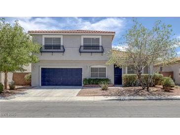 Charming two-story home featuring desert landscaping, a two-car garage, and decorative window awnings at 2367 Tilden Way, Henderson, NV 89074