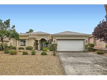 Charming single-story home featuring well-maintained landscaping and a two-car garage at 4311 Fiore Bella Blvd, Las Vegas, NV 89135