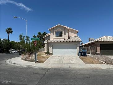 Two-story home on a corner lot with a two car garage and tile roof at 5128 Sandstone Dr, Las Vegas, NV 89142