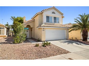 Charming two-story home featuring a well-maintained stucco exterior and a two-car garage at 5332 Desert Blossom Rd, Las Vegas, NV 89107