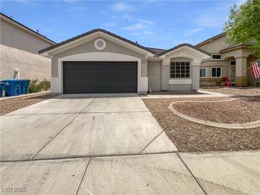 Charming single-story home featuring a two-car garage and low maintenance landscaping at 7524 Fencerow St, Las Vegas, NV 89131