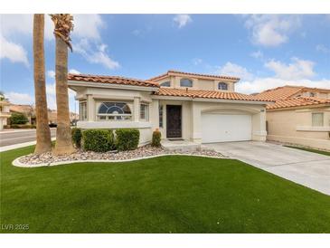 Charming two-story home with manicured lawn and desert landscaping at 8780 Autumn Wreath Ave, Las Vegas, NV 89129