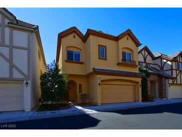 Charming two-story home featuring an attached two-car garage and well-maintained front yard at 9209 Tudor Park Pl, Las Vegas, NV 89145