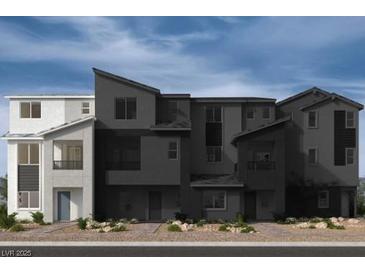 New townhouse complex showing modern architectural details and landscaping at 9243 Stonewall Ridge Ct, Las Vegas, NV 89148
