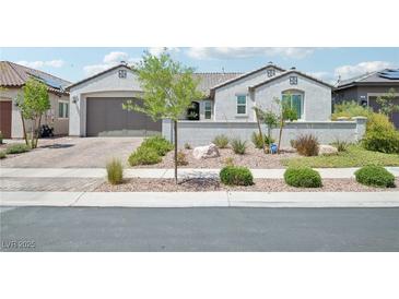 Charming single-story home showcasing a well-kept front yard and a two-car garage at 172 Lunga Ave, Henderson, NV 89011