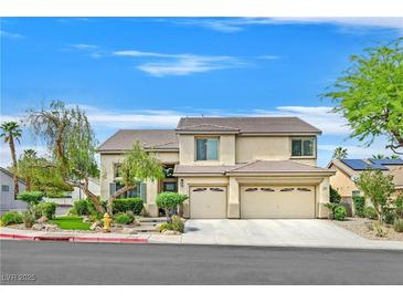 Charming two-story home featuring a three-car garage, mature trees, and well-maintained landscaping at 1780 Crystal Stream Ave, Henderson, NV 89012