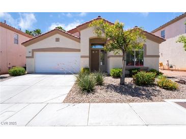 Charming single-story home with well-maintained landscaping and neutral-toned exterior at 203 Sea Rim Ave, Las Vegas, NV 89148