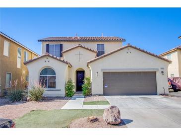 Charming two-story home featuring a well-kept lawn, an attached two-car garage, and desert landscaping at 4429 E Azure Ave, Las Vegas, NV 89115