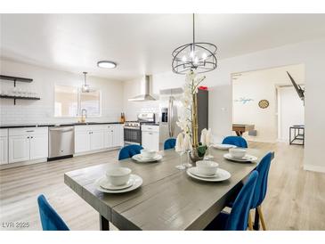 Bright dining area showcases stylish table setting and modern lighting near the kitchen at 4471 Wisconsin Ave, Las Vegas, NV 89104