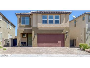 Charming two-story home with a two-car garage and inviting front entry at 5966 Icicle Falls Ave, Las Vegas, NV 89130