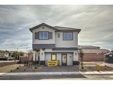 Two-story model home featuring a gray and white color scheme and eye-catching architectural details at 8447 Sycamore Creek St, Las Vegas, NV 89148
