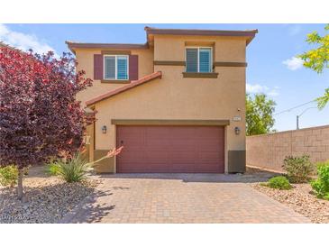 Charming two-story home with a two car garage and low maintenance landscaping at 9161 Rolling Sky Dr, Las Vegas, NV 89178