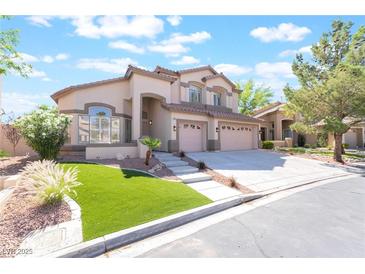 Charming two-story home featuring a three-car garage, manicured lawn, and a welcoming entrance at 1016 Eaglewood Dr, Las Vegas, NV 89144