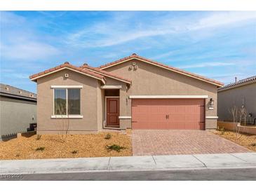 Charming single-story home with a well-manicured yard and appealing desert landscaping at 2727 Avril Point St, Las Vegas, NV 89156
