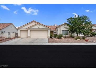Charming single-story home featuring a two-car garage, desert landscaping, and a classic Southwestern style at 4628 Standing Bluff Way, Las Vegas, NV 89130