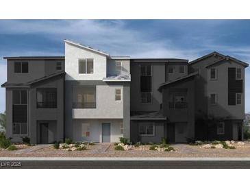 Modern townhome showcasing a sleek architectural design and neutral color palette at 5872 Wisteria Walk, Las Vegas, NV 89148