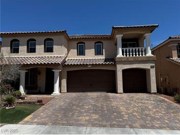 Attractive two-story home featuring a three-car garage and a beautifully paved driveway at 6454 Mount Palomar Ave, Las Vegas, NV 89139