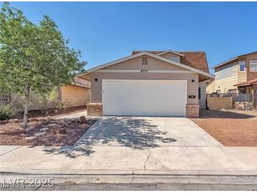 Charming home featuring a two-car garage and landscaped front yard, perfect for suburban living at 6717 Sheffield Dr, Las Vegas, NV 89108