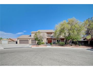 Charming two-story home featuring a three-car garage and well-maintained landscaping at 6821 Jeanette St, Las Vegas, NV 89131
