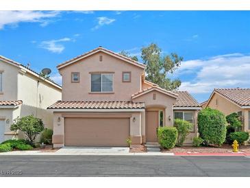 Charming two-story home featuring a 2-car garage and well-maintained landscaping at 927 Clear Diamond Ave, Las Vegas, NV 89123