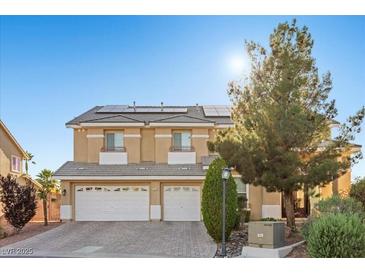 Charming two-story home featuring a paved driveway and solar panels for energy efficiency at 7221 Harlow St, Las Vegas, NV 89131