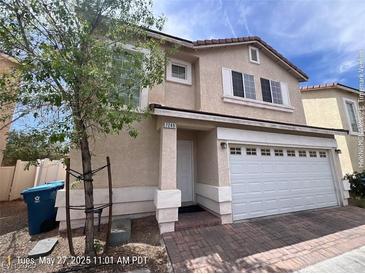 Charming two-story home with a two-car garage and a well-maintained front yard at 7249 Linaria Rd, Las Vegas, NV 89113