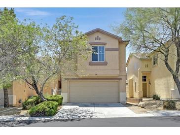 Charming two-story home featuring desert landscaping, neutral colors, and an attached two-car garage at 9105 White Eyes Ave, Las Vegas, NV 89143