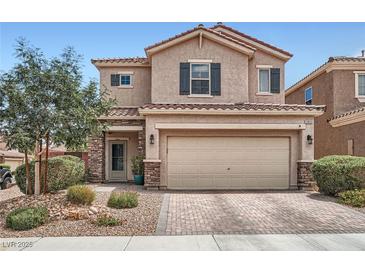 Charming two-story home with landscaped front yard and a two-car garage at 9853 Bangalore Ct, Las Vegas, NV 89148