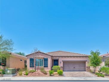 Charming single-story home with a well-manicured front yard and attached two-car garage at 280 Via Del Duomo, Henderson, NV 89011