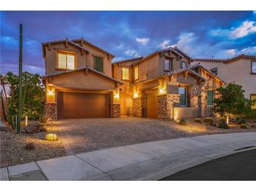 Striking two-story home featuring a stylish facade and a well-manicured desert landscape at 2862 Athens Ridge Dr, Henderson, NV 89052