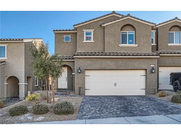 Inviting two-story home with a well-maintained lawn and a two-car garage, perfect for Gathering living at 377 Yellow Finch Ln, Henderson, NV 89012