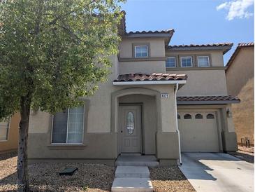 Charming two-story home with a well-maintained yard and covered entryway at 4825 Shea Stadium Ave, Las Vegas, NV 89139
