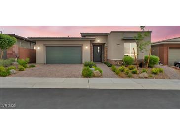 Charming single-story home with manicured landscaping and a neutral color scheme, enhancing curb appeal at 6865 Steel Mist St, Las Vegas, NV 89148