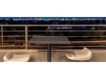 Enjoy the scenic Las Vegas skyline from this home's cozy balcony with comfortable seating at , Las Vegas, NV 89135