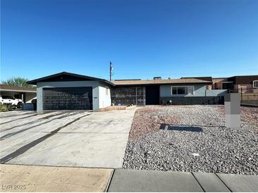 Charming single-story home featuring a spacious driveway and low-maintenance desert landscaping in the front yard at 1304 Bonita Ave, Las Vegas, NV 89104