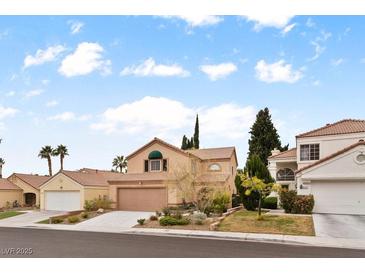 Charming two-story home with a well-manicured front yard and a two-car garage in a quiet neighborhood at 3217 Harbor Vista St, Las Vegas, NV 89117