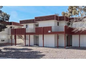 Apartment building showcasing balconies, brown roofing, and tan paint for a stylish and modern living space at 5404 Swenson St # 34, Las Vegas, NV 89119
