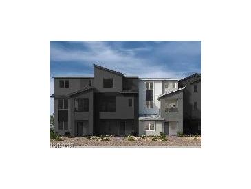 Modern three-story townhome showcasing a sleek architectural design and neutral color palette at 5870 Kips Bay St, Las Vegas, NV 89148