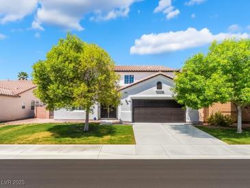 Charming two-story home with well-maintained landscaping and a two-car garage at 7857 Midnight Ride St, Las Vegas, NV 89131