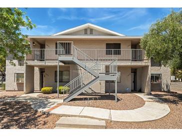 Apartment building featuring pedestrian access and outdoor walkways on a sunny day at 2898 Violet Ln # 0, Henderson, NV 89074
