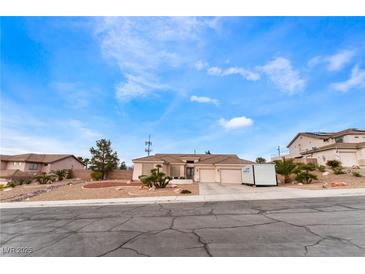 Charming single-story home featuring a well-manicured yard and a three-car garage at 7076 Oakleigh Dr, Las Vegas, NV 89110
