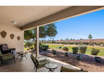 Inviting covered patio with views of the golf course and desert landscaping at 1187 Mohave Dr, Mesquite, NV 89027