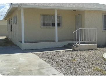 Charming single-story home with a front porch and a low-maintenance yard at 1225 W Van Buren Ave, Las Vegas, NV 89106