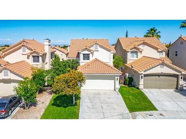 Charming two-story home with a tile roof, two-car garage, and well-maintained landscaping at 2316 Pine Bluff Ct, Las Vegas, NV 89134