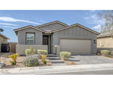 Charming single story home with a well maintained xeriscaped front yard at 2395 Arrington Ave, North Las Vegas, NV 89086