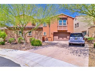 Charming two-story home with a beautiful brick driveway and well-maintained landscaping at 2497 Birch Hollow St, Henderson, NV 89044