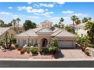 Charming single-story home with a well-manicured front yard, driveway, and two-car garage at 277 Dark Forest Ave, Las Vegas, NV 89123