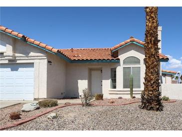 Charming single-story home features a tile roof, stucco exterior, and low-maintenance desert landscaping at 3236 Manzanita Ln, Laughlin, NV 89029